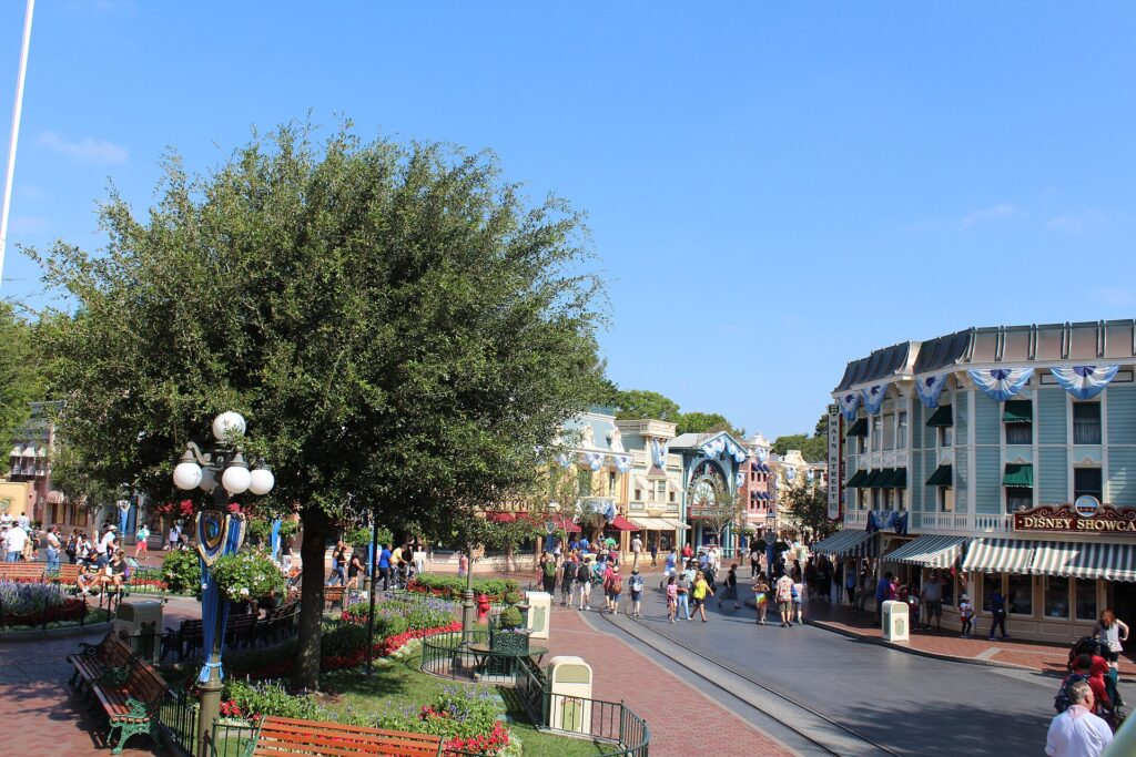 Guests strolling down Main Street, U.S.A. on a sunny day