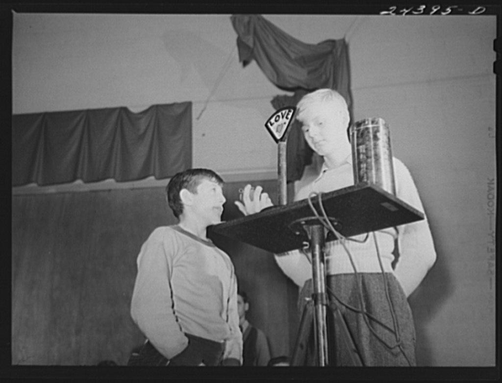 Students run a radio quiz program for a school assembly at Homestead School, West Virginia
