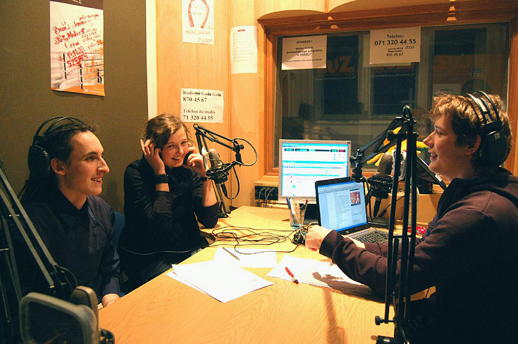 Student hosts on the microphones at Akademickie Radio LUZ, a university student radio station